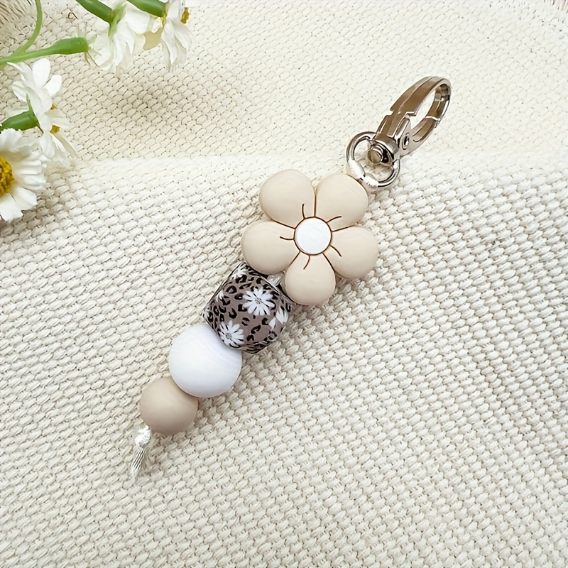 E-shop 1 Stück Silikon-Blumenperlen-Schlüsselanhänger mit Gänseblume & Leoparden-Print-Charm, eleganter Beige & Weißer Dekorationsanhänger für ,