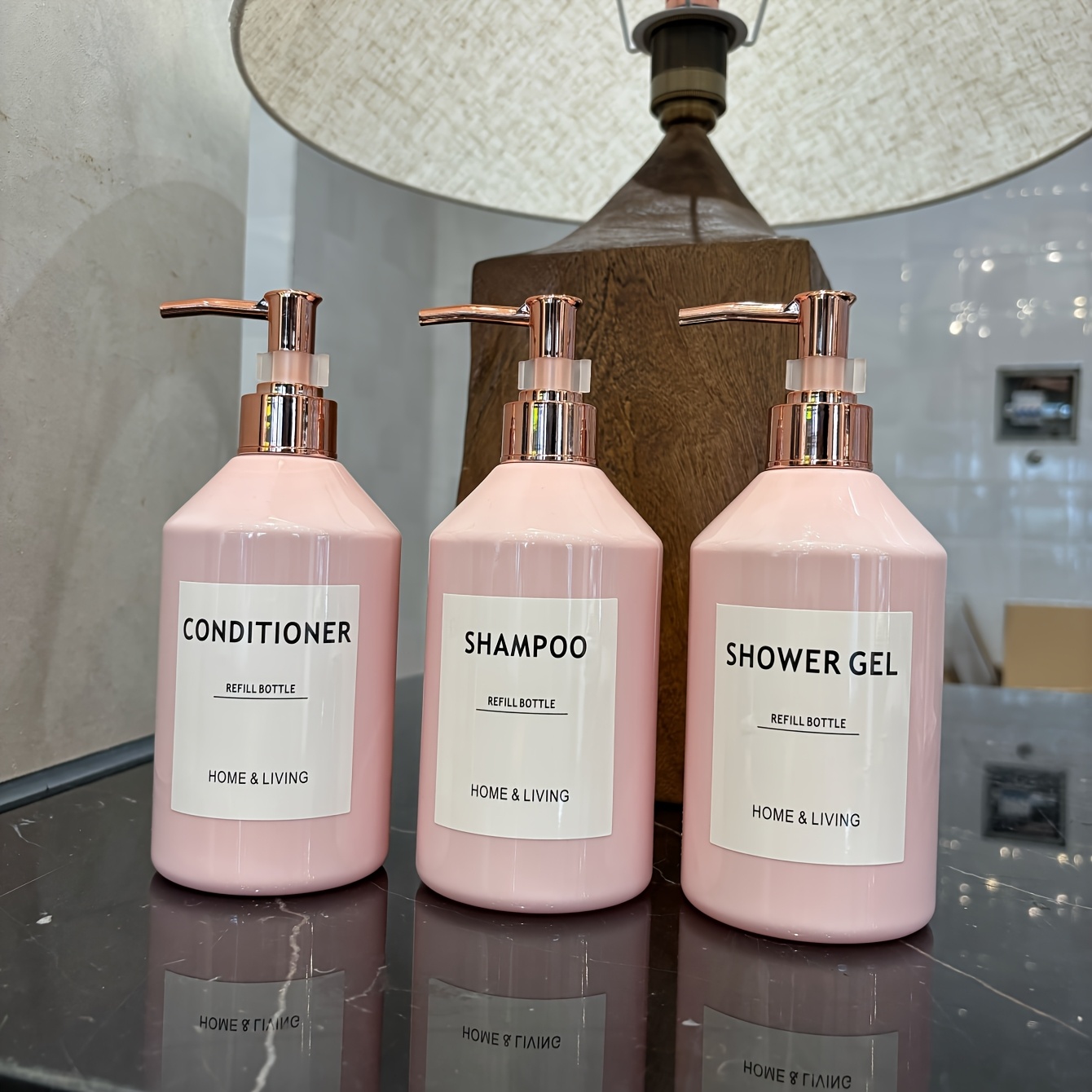 Image of A Set Of 3 500ml/16oz Pink Slanted Shoulder Pet Bottles For Hotel Bathroom, Including Containers For Conditioner, Shampoo, And Body Wash, Featuring A Pump Dispenser And Waterproof Labels