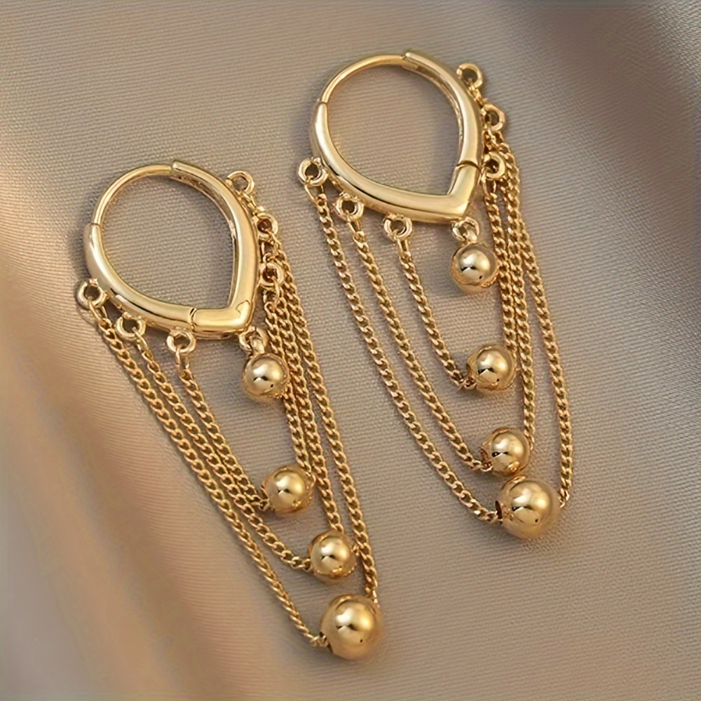 

Long Tassel Earrings With Korean Fashion Style, The 2024 New Jewelry Trend Features A Hip-hop Stainless Steel Golden Sphere Pendant For Women's Accessories.