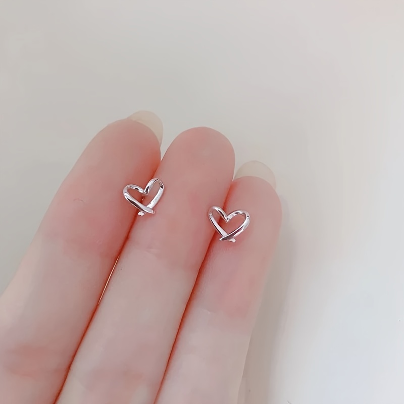 Image of 2pcs/1pairs - Minimalist Love Heart Small Hollow Heart Stainless Steel Earrings, Suitable For Commuting And Versatile For