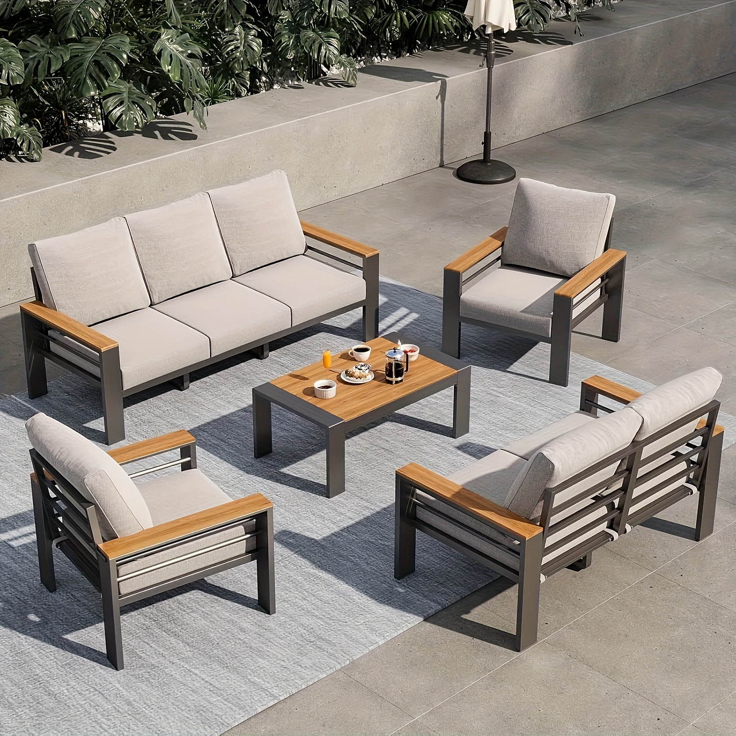 aluminum outdoor patio furniture set with   cushions and armrests   backyard garden and poolside relaxation
