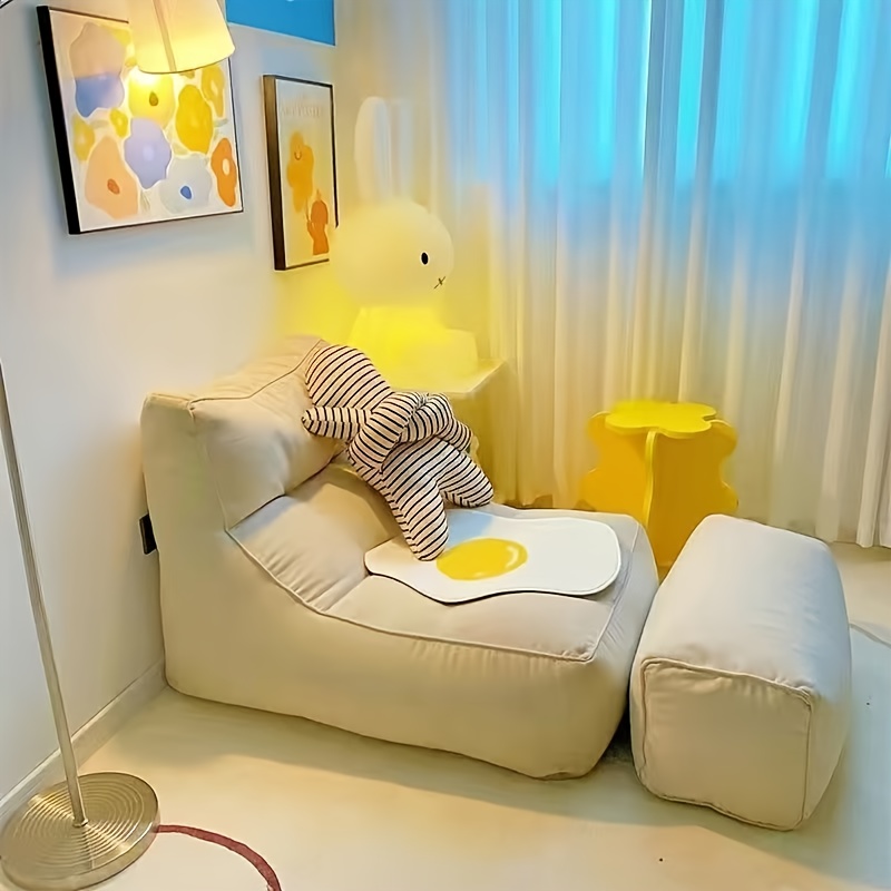 A Comfortable Sofa That Can Be Adjusted for Reclining Or Sleeping, a Single-Person Lounge Chair, a Small Tatami Bed for Humans Resembling a Dog Bed, And a Bean Bag Lounge Chair