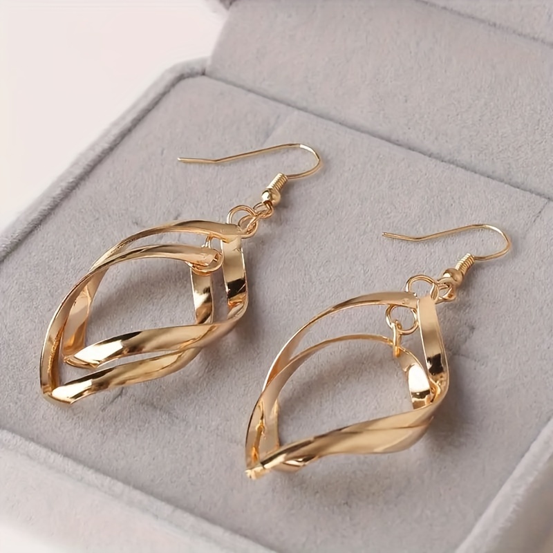 Image of Golden Hollow Out Alloy Geometric Twisted Rhombus Dangle Earrings, Hypoallergenic Ear Jewelry In A Retro , Designed For Women.