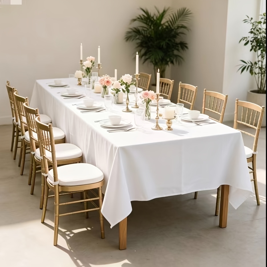 Image of A White Party Tablecloth Made Of High-quality Smooth Fabric, A And Drape. It Features Glossy Texture, Is Wrinkle-resistant And Fade-resistant, And Washed Repeatedly For Reuse. Suitable For Table