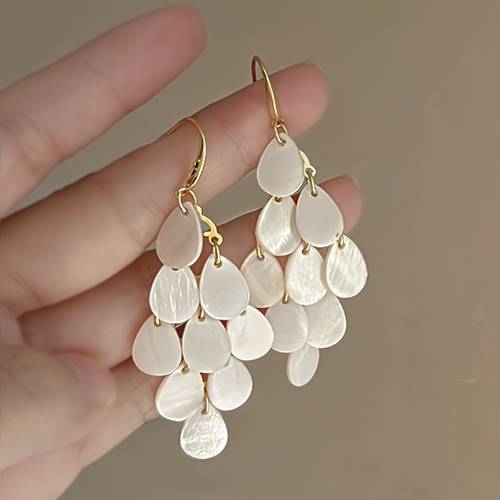a pair of stylish spring and summer shell tassel earrings for women suitable for daily wear holidays parties weddings engagements banquets beach vacations gifts for friends and mothers day presents