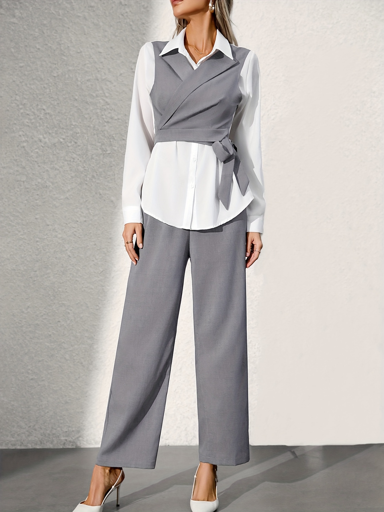 Detailed shot of the trousers' waistband and drape