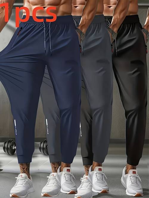 pantalones deportivos casuales para hombre para , hechos de tela cómoda y , con bolsillos con cremallera . adecuados para , el , los viajes, el senderismo, correr y el ocio en casa