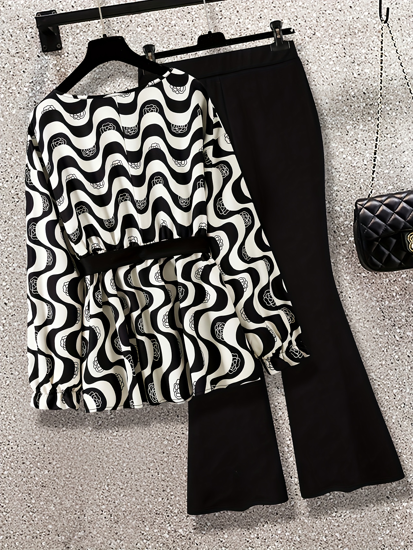 Newness Modernist Geometric Pantsuit Chic black and white geometric print pantsuit perfect for springsummer Model wears a sharp tailored fit