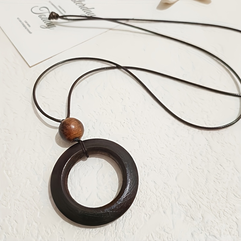 Image of Long Wooden Necklace For Women Featuring Wood Pendant And A , Perfect For Daily Use And Special Occasions. This Elegant Neutral Enough For Wear, Exuding A Retro Charm And By