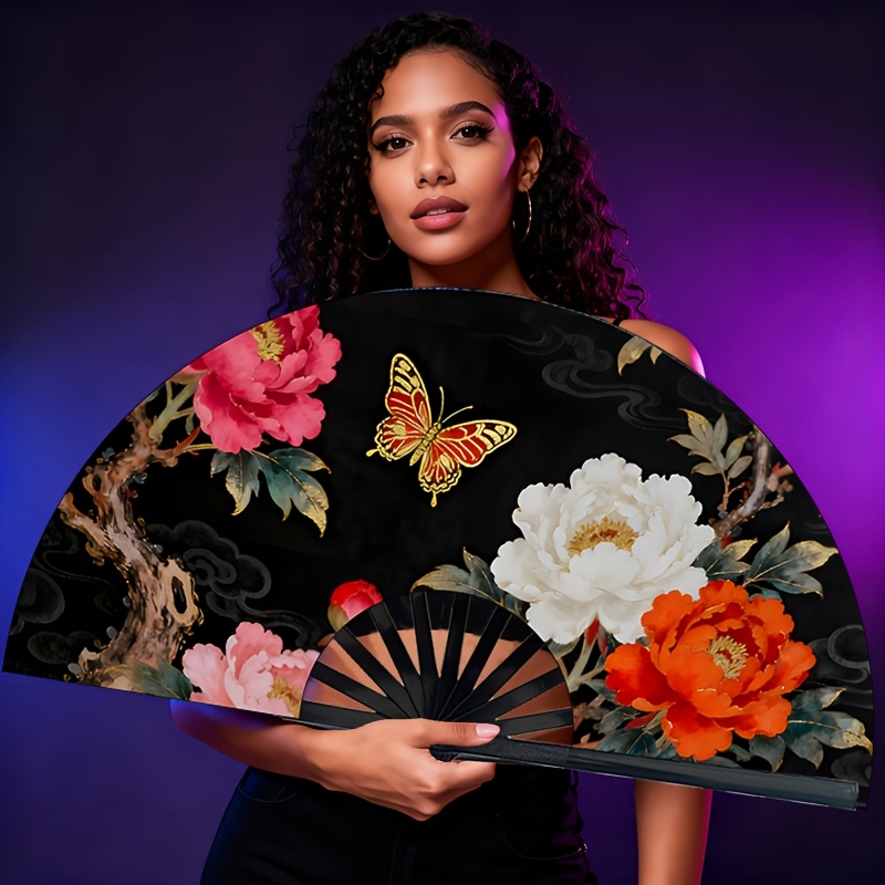 A Chinese Peony Hand-held Fan Foldable And Portable, Suitable For Everyday Use By Women, Parties, Performances, And As A Gift, Featuring Patterns And Classic Vibrant Colored Peony Designs