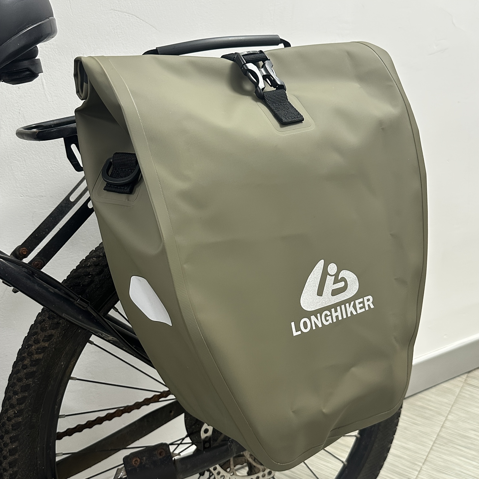 Mountain Bike Backpacks With Front And Rear Hanging Compartments And Side Compartments. The Design Features Rolled-up And Closed Closure For During Long-distance Rides.