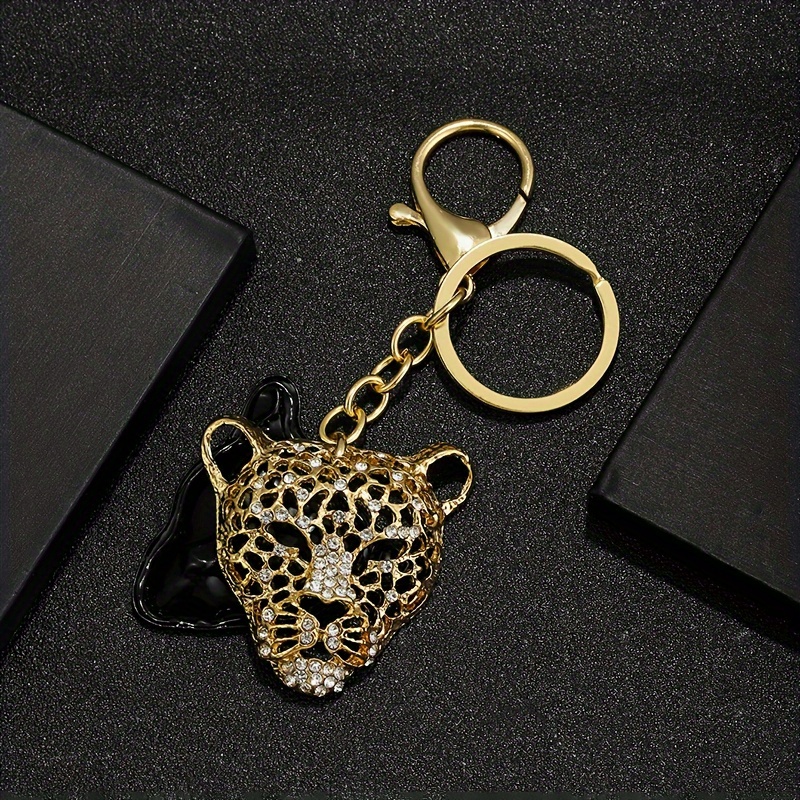 

Gold And Black Leopard Head Keychain, Crystal Studded, Dual Tone Hollowed-out Alloy, Fashionable Unisex Accessory