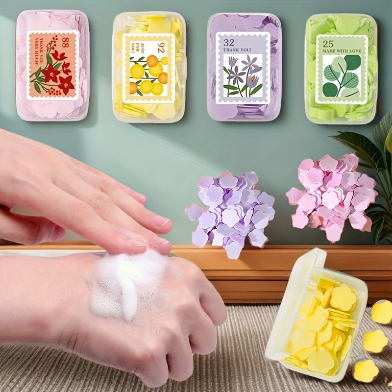 1 pudełko (100 tabletek) jednorazowych tabletek mydlanych, przenośne mydło do mycia rąk na podróże na świeżym powietrzu, przenośne tabletki mydlane do podróży hotelowych, mini tabletki mydlane w kształcie płatków do podróży służbowych