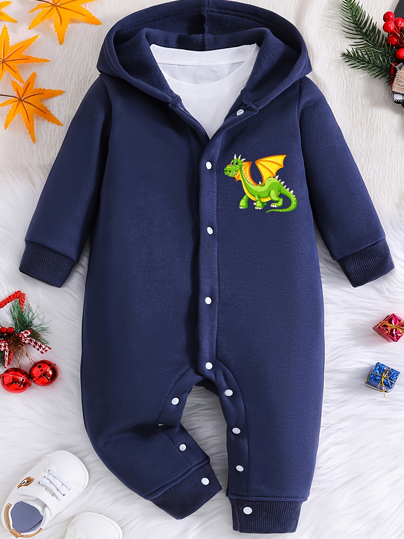 Un de bebé con capucha y largas, con un lindo estampado de dibujos  animados de un pequeño para recién nacidos de