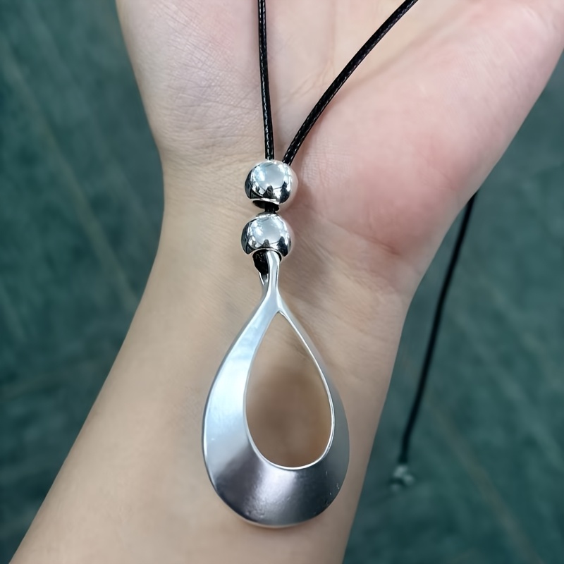 TEMU 1pc Minimalist Individual Style Large Water Drop Silvery Hollow Black Rope Men Women Long Necklace Suitable For Couple Daily Gathering Party