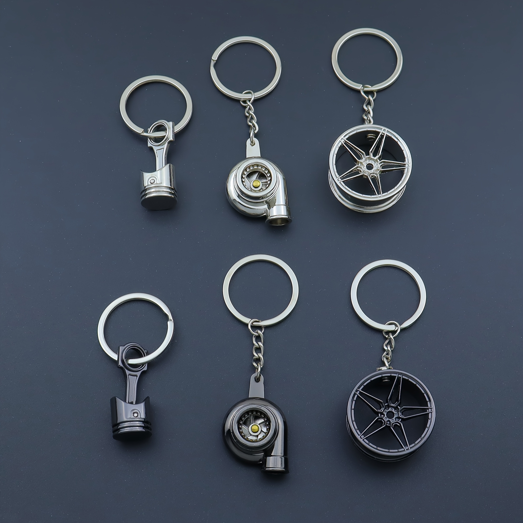poza articolului set de 3 brelocuri creative cu piese auto, cu piston,   și butuc roată, un breloc care reprezintă   modificărilor auto, perfect ca un cadou