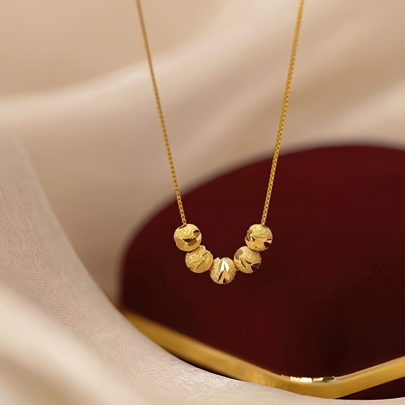 

Minimalist Stainless Steel Necklace With 5 Beads And Featuring A Box Chain Is Women's Everyday Wear.