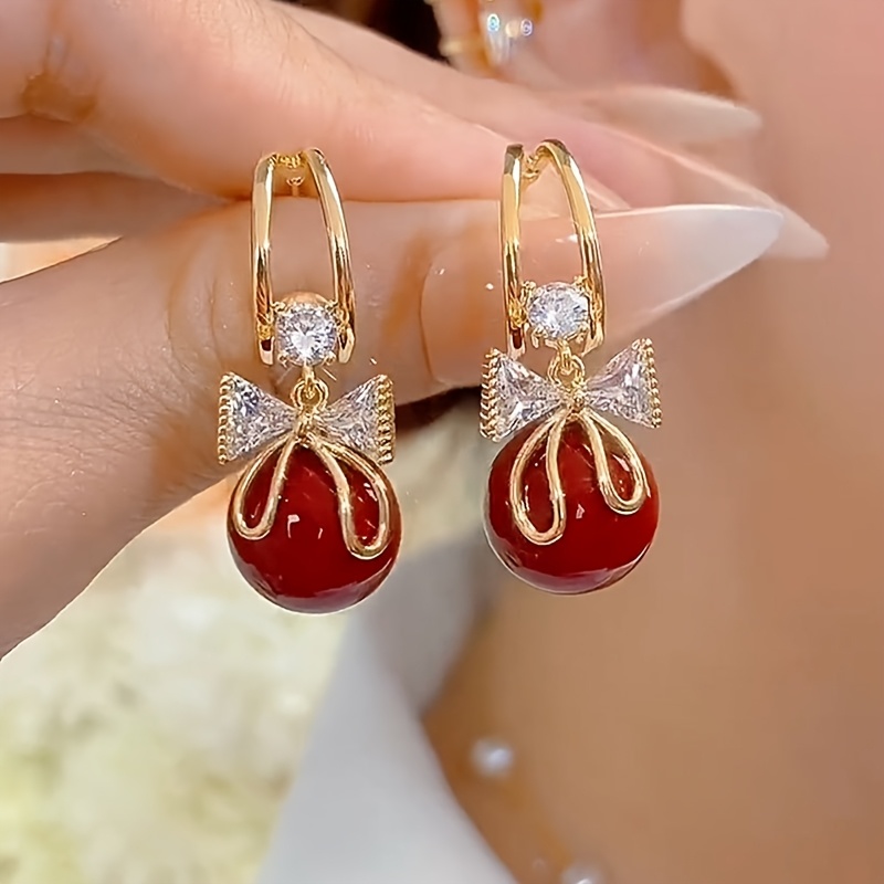 TEMU Une paire de boucles d'oreilles mignonnes avec nœud et perles rouges, un accessoire de luxe léger, polyvalent et délicat pour un port