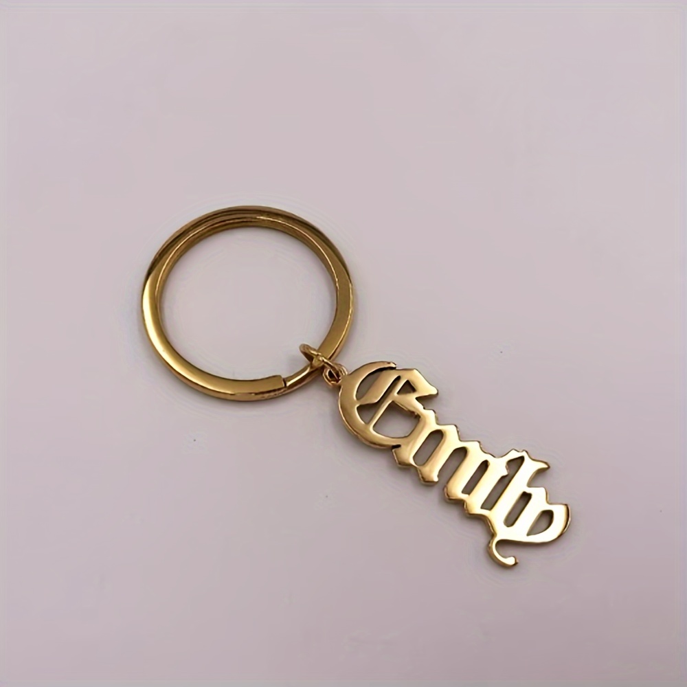 TEMU A Stainless Steel Keychain Featuring A Personalized Gothic English Name, An Oval Keyring With A Letter Theme, Equipped With A Loop For Everyday