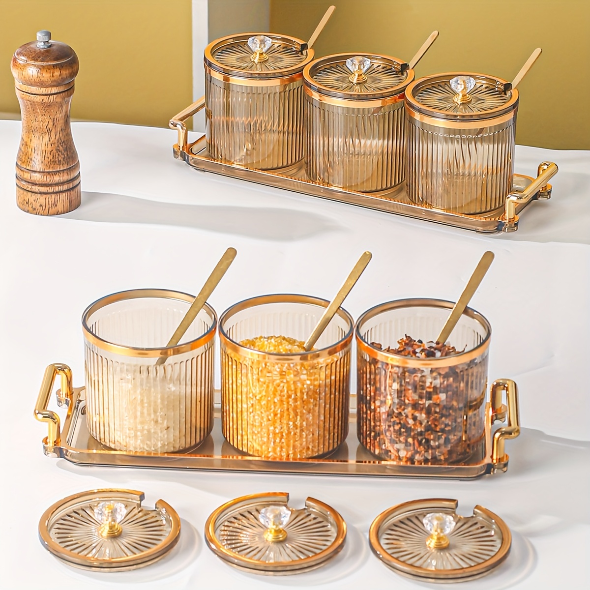 

A Stylish Set Of Seasoning Jars For The Kitchen, Featuring With And 3 Jars, Complete With Spoons.