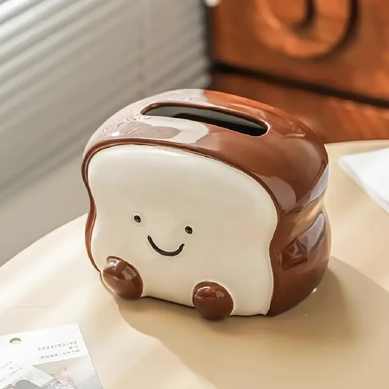 visually appealing toast shaped ceramic tissue box holder smiling bread design with pink flower detail accents living room bedroom or kitchen decor Product details 6