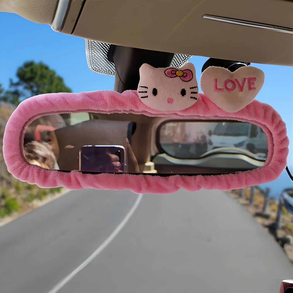 An Authorized Car Rearview Mirror Decoration Featuring a Cute Cartoon Design of for hello kitty, a Pink Mirror Cover That Is Highly Elastic And Suitable for Most Vehicle Interiors.