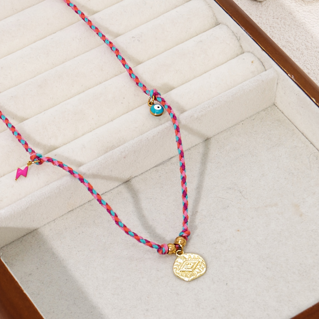Image of A Women's Necklace Featuring A Vintage Round Pendant, An Evil Eye, And A Chili Pepper Charm, Handcrafted With Colorful Braided Cord, Suitable For Parties And Everyday Wear