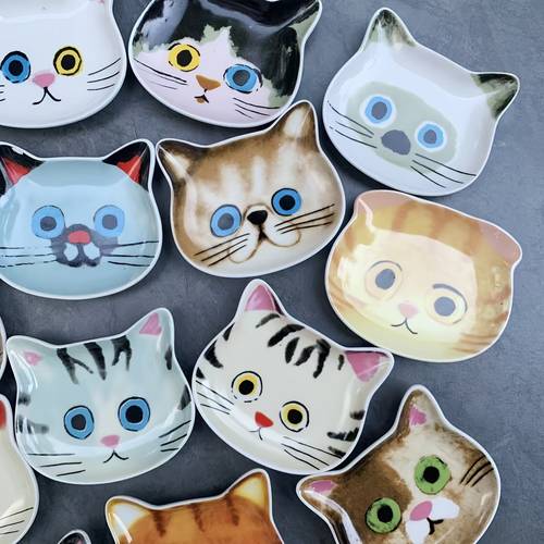 set of ceramic small dishes for soy sauce vinegar dipping and seasoning for hot pot along with a coffee spoon and spoon rest