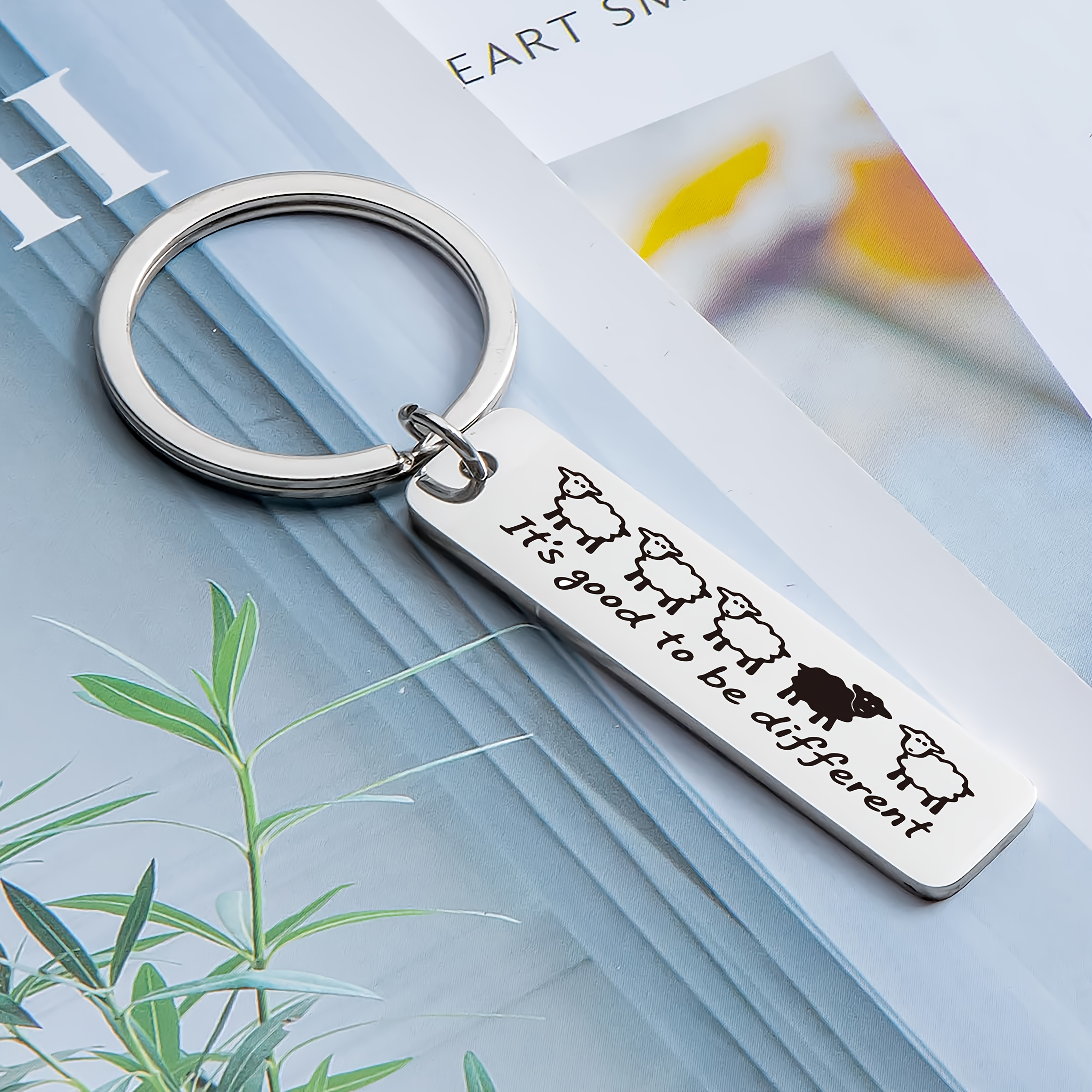 1pc Creative Lamb Keychain, Made Of Stainless Steel, Engraved With " Different," Featuring Lamb Designs, Which Is Dark-colored To Highlight . It Conveys Of Encouraging
