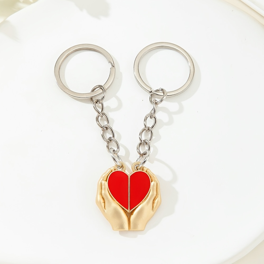 A Pair Of Heart-shaped Keychains, Perfect For Valentine's Day, Serving As Romantic Additions For Couples, Symbolizing Love And Friendship