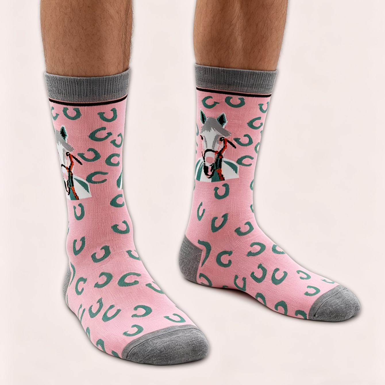 A Pair Of Men's Pink Mid-calf Socks With A Horse Pattern
