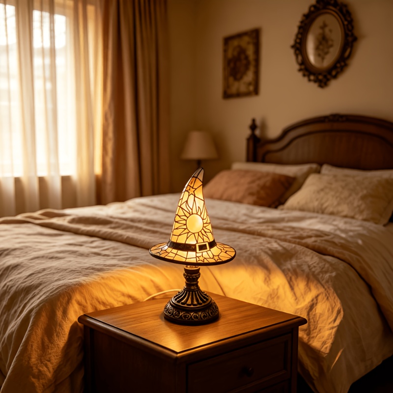 Small pointed yellow wizard-hat-shaped lamp on a bedside table