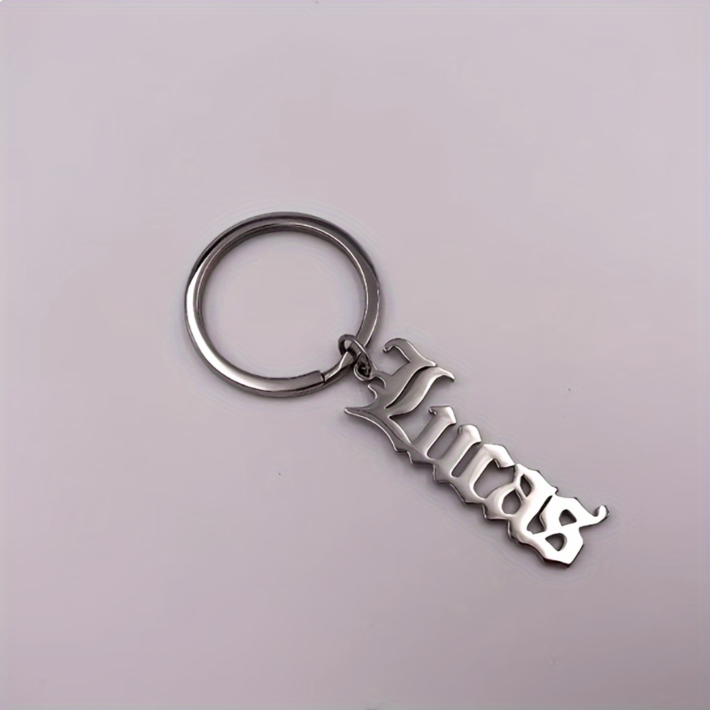 TEMU A Stainless Steel Keychain Featuring A Personalized Gothic English Name, An Oval Keyring With A Letter Theme, Equipped With A Loop For Everyday