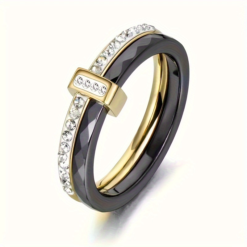 

A Stylish And Sexy Black Ceramic Double-loop Ring, Adorned With Crystals - Made Of Stainless Steel Material, Available In Golden And Silvery, Sizes 6-9 - Perfect For A Date Night Or Anniversary