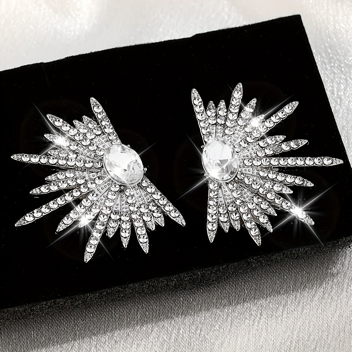 A Pair of Dazzling Wing-Shaped Earrings Adorned with Rhinestones, Perfect for Women. These Elegant And Distinctive Bridal Earrings Are Trendy, Lightweight Statement Pieces Ideal for Proms And Parties