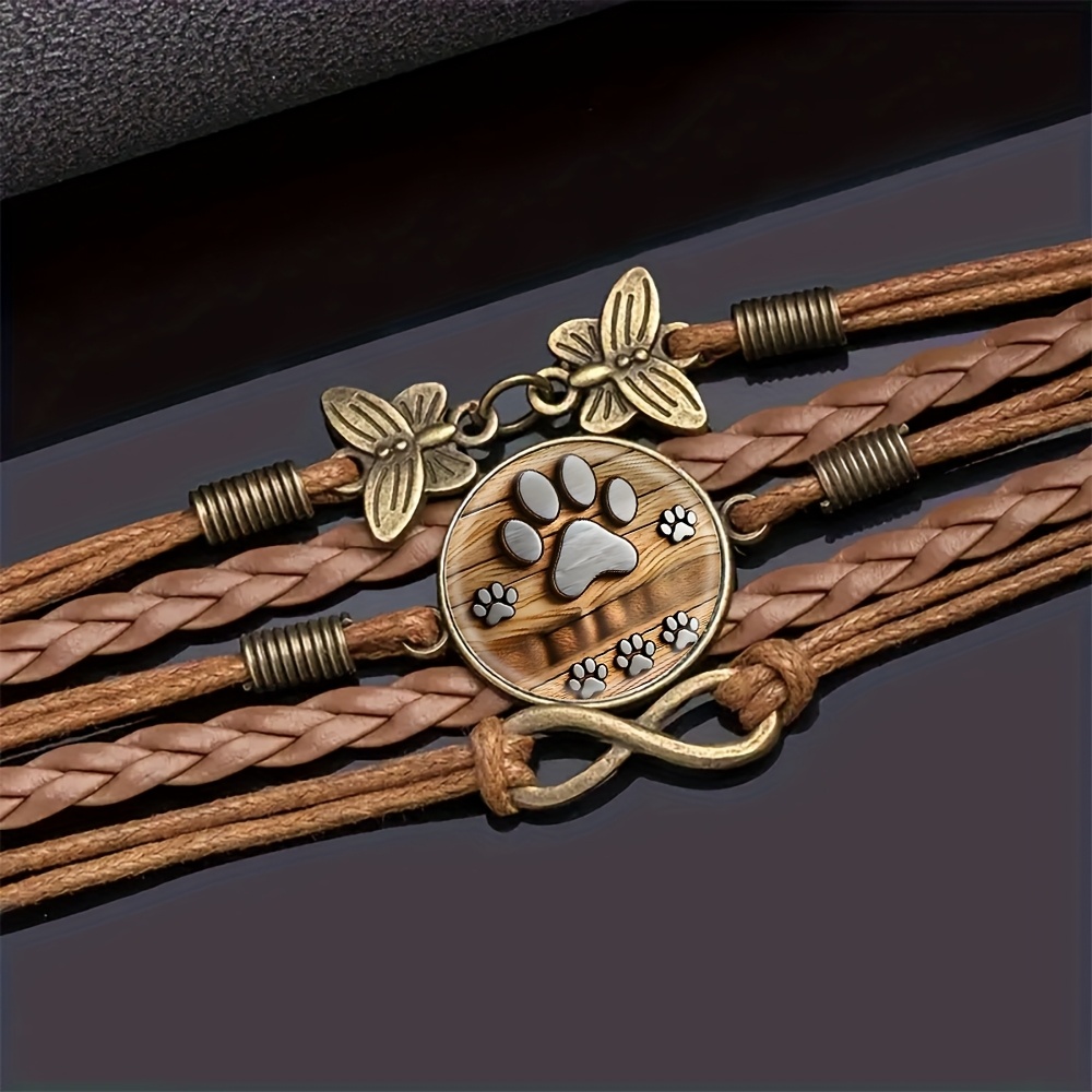 TEMU Adjustable Bohemian Mandala Infinity Bracelet - A Stylish Accessory Featuring A Metal Paw Print Design On A Faux Leather Wooden Backdrop, In A