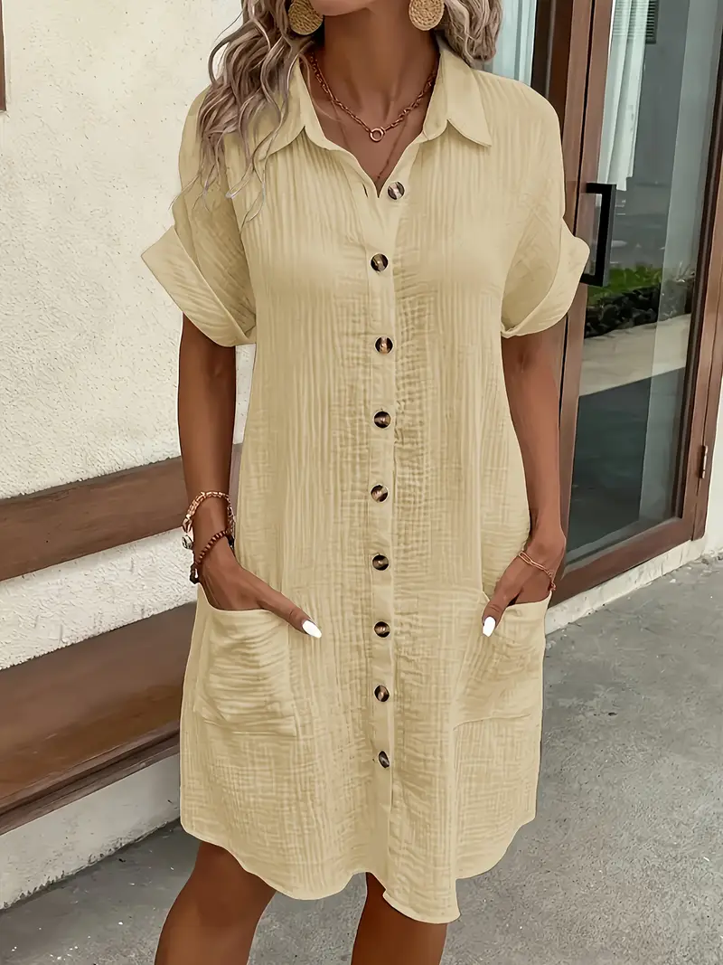 a minimalist white shirt dress made of breathable featuring a sharp collar design and buttons that add a touch of details 7