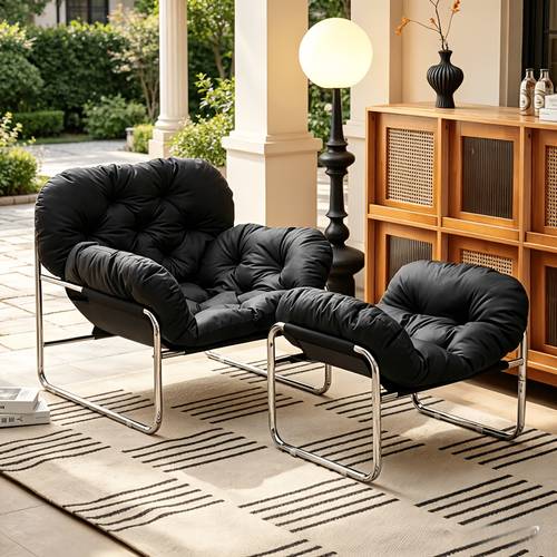 a single person patio porch or garden chaise lounge with footrest featuring a simple yet luxurious design the creamy vintage style wicker and electroplated are perfect for relaxing reading listening to music or sleeping