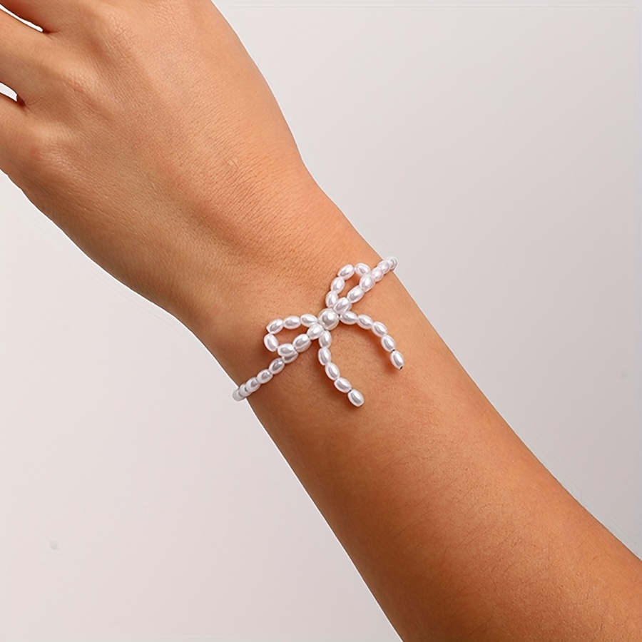 

A Stylish Beaded French-knotted Bow Bracelet, Simple And Personalized, Suitable For Ladies To Wear At Parties And , A Touch Of .