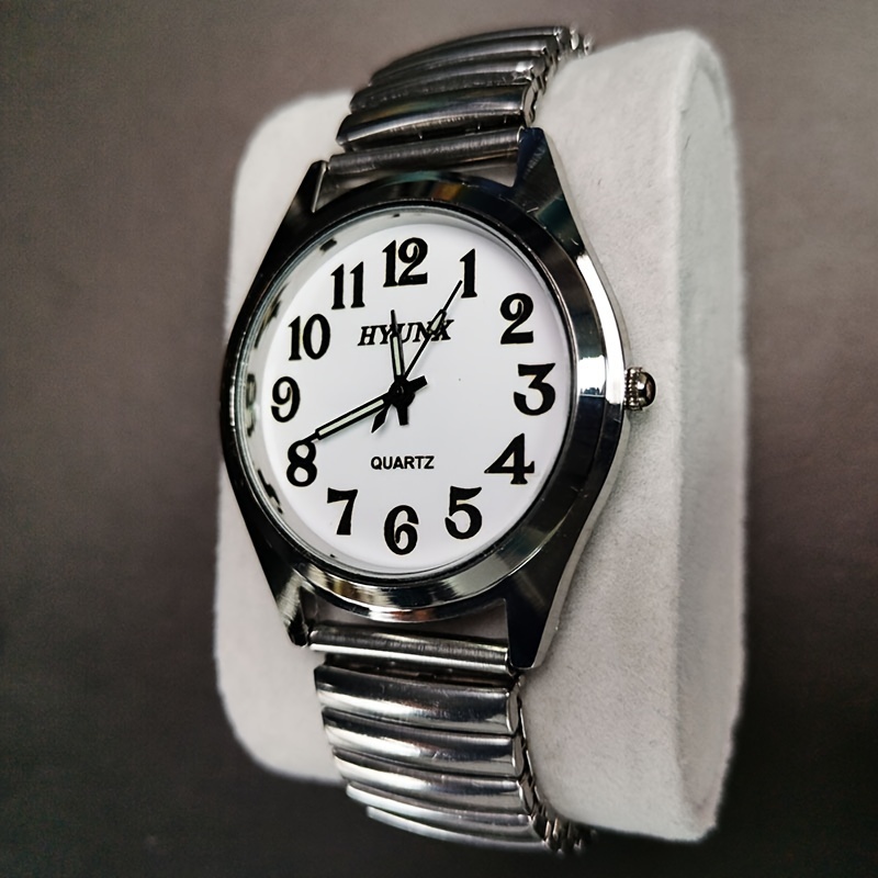 

Vintage Quartz Wrist Watch With Luminous Hands And Large Numerals, Stainless Steel Spring Band, Round Electronic Movement Dial, Classic Timepiece With Pointer Display
