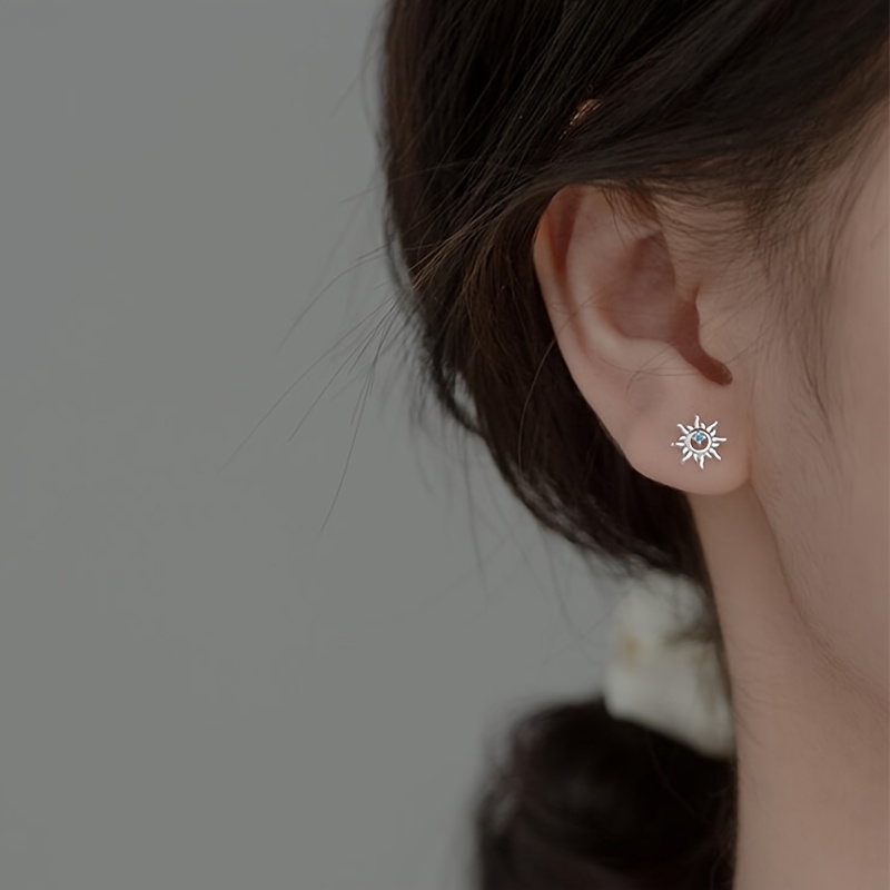 Hollow Sun-Shaped Bead Screw Earrings with Synthetic Zirconia