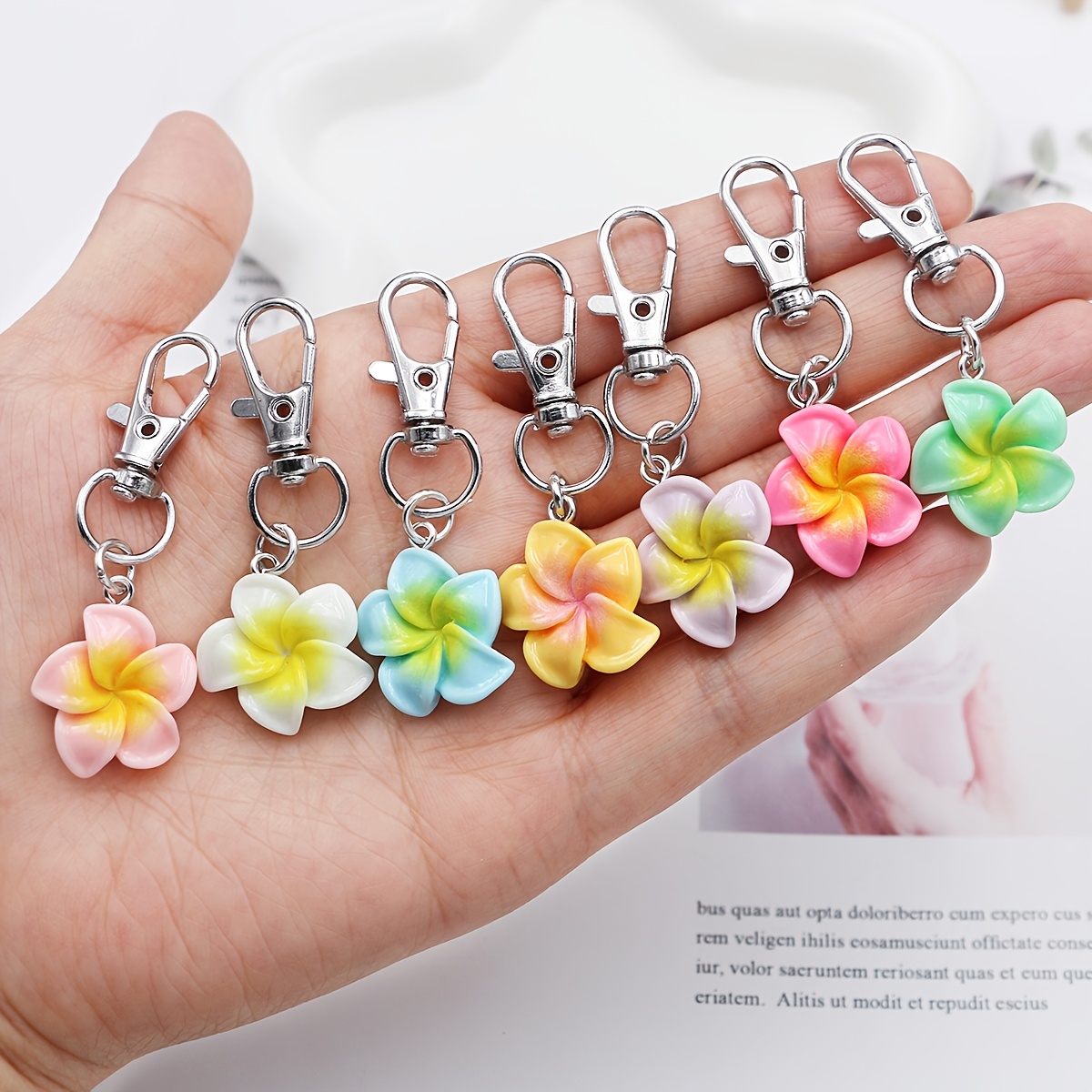 

7pcs Frangipani Flower Keychain Set, Resin Egg Charms With Alloy Metal, Lobster Clasp Key Rings, Decorative Plant-themed Keyrings For Bags & Car Keys, Ideal Valentine's Day Gift