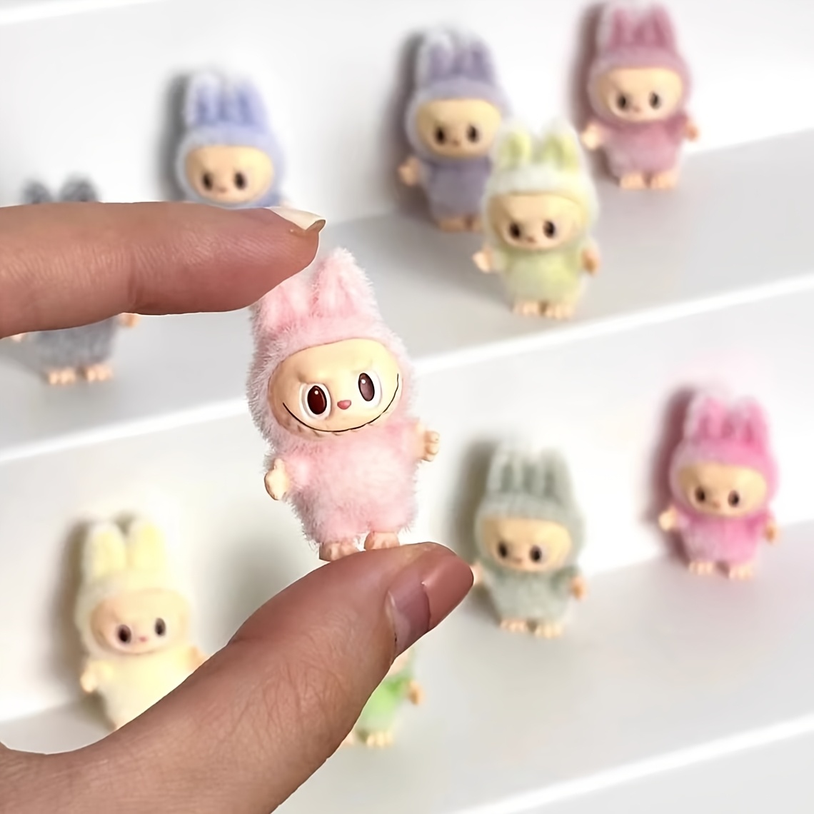 

Random Styles Of Mini Plush Labubu Pendants In Colors Made Of Pvc Material, Cute Little Desk Figures, Collectible Keychain Decorations, And Mini Decorative Accessories.