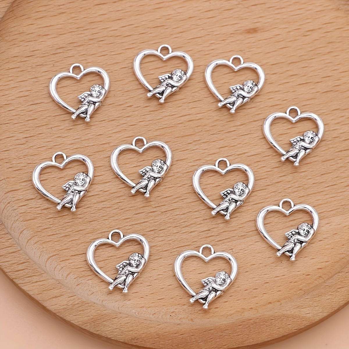 Image of Set Of 10 Silvery Heart-shaped Charms And Pendants For Crafting Personalized Jewelry Like Necklaces, Earrings, And