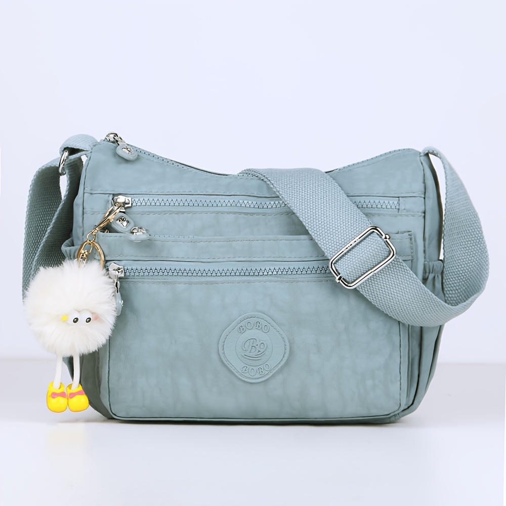 stylish lightweight multi pocket unisex crossbody bag with pendant elegant durable womens shoulder bag sturdy anti theft womens crossbody bag durable fabric multiple compartments adjustable straps perfect for travel daily use commuting Product details 17