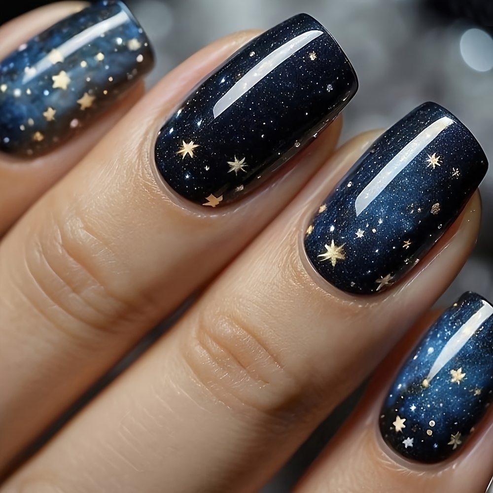 E-shop 24 Stück Sternenhimmel Press-On Nagelset, Schwarz/Blau Töne, Glänzende Spitze, Mittellange Quadratische Nägel, Sternmuster, mit Gel Kleber und