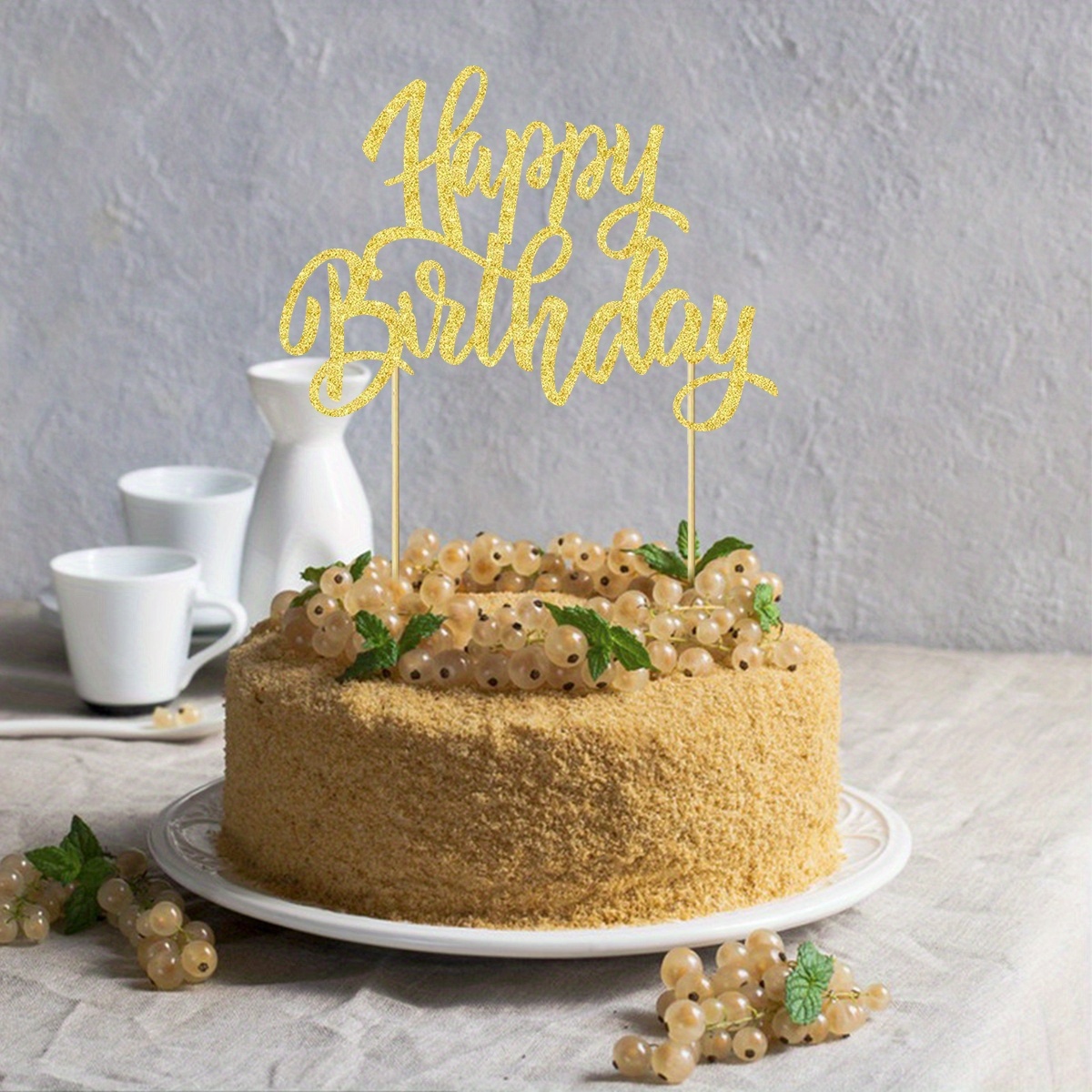 a birthday cake decoration sign celebrating a birthday party