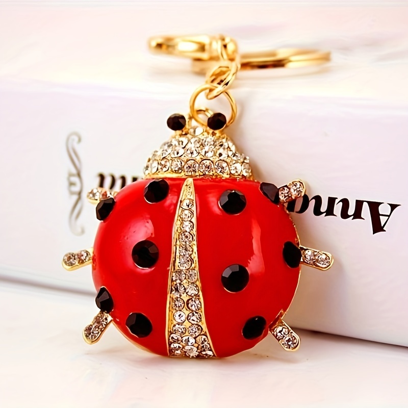 A Cute And Creatively Designed Metal Keychain Featuring A Jeweled Ladybug, Perfect As A Gift