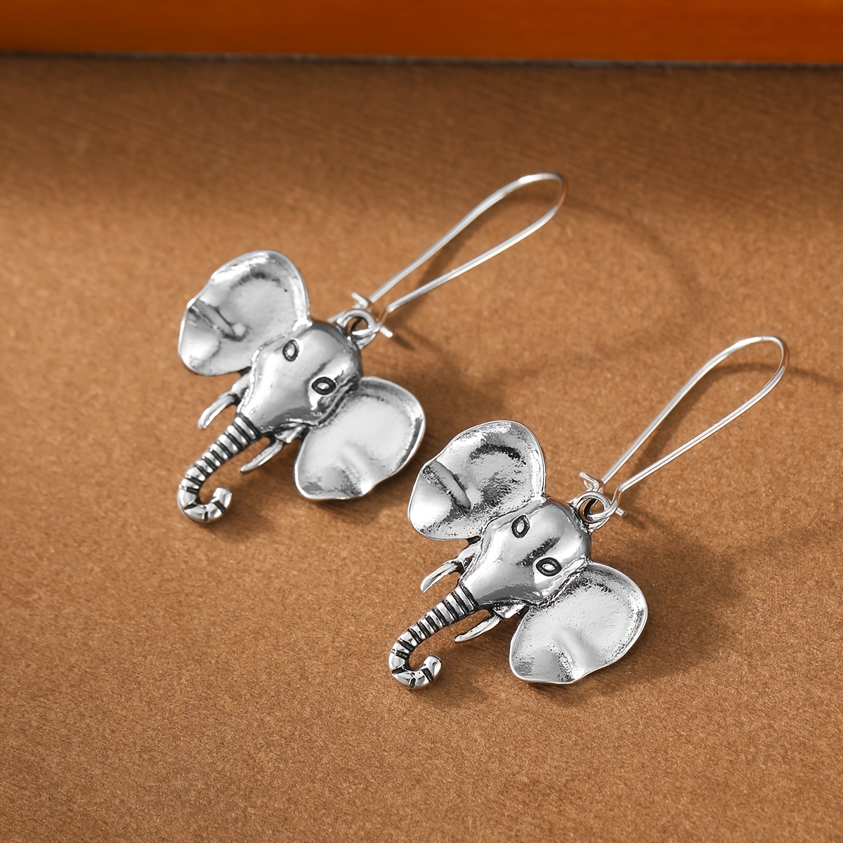 Women's Retro Distressed Elephant Head Long Earrings — Party Ready