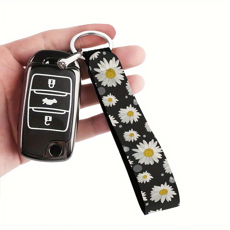 

A Polyester Wristband Keychain With A Daisy Pattern, Suitable For Both Men And Women, Can Be Used For Car Keys, Cameras, Backpacks, Phones, And House Keys.